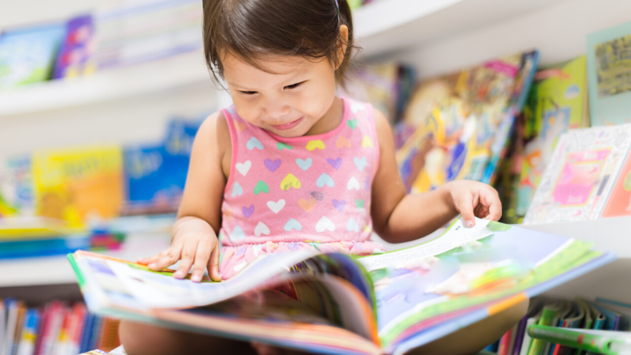 Little girl reading.